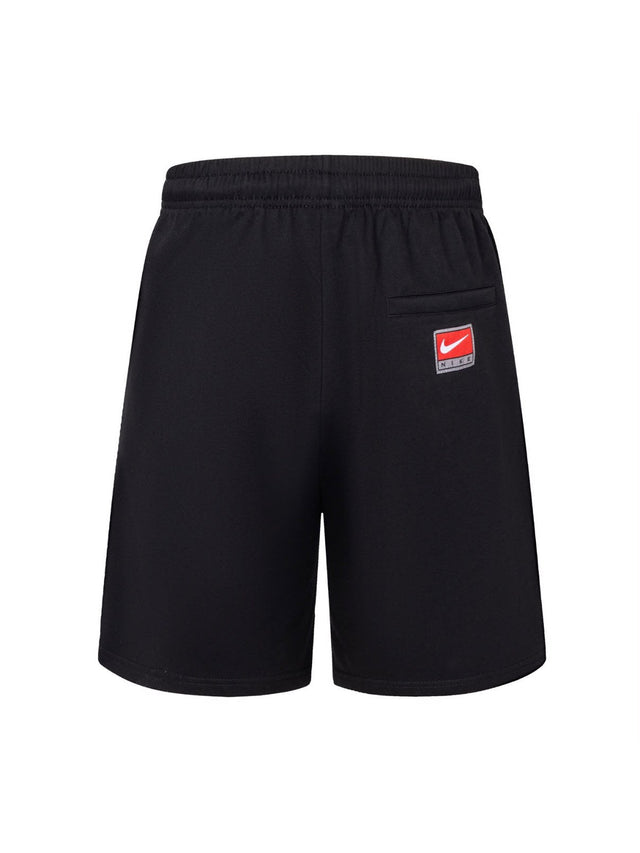 Short Nike negro con letras amarillas
