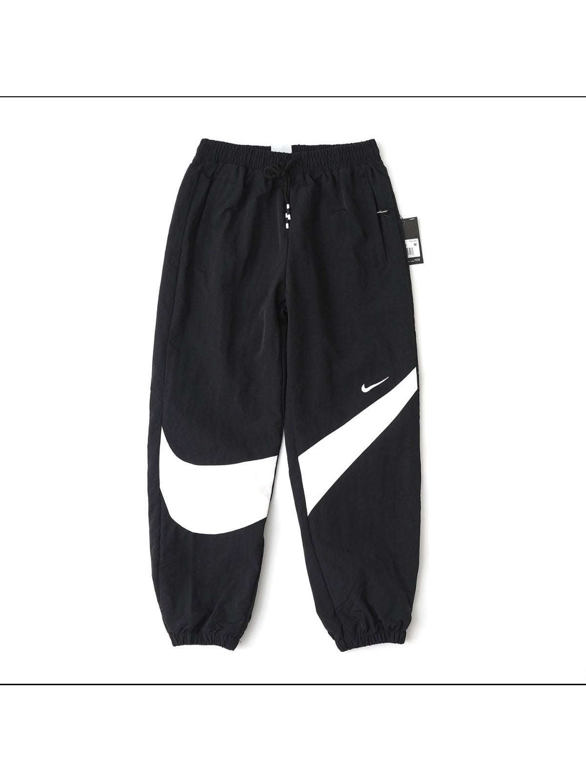 Pantal�n Nike negro con swoosh grande