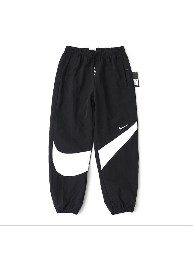 Pantal�n Nike negro con swoosh grande