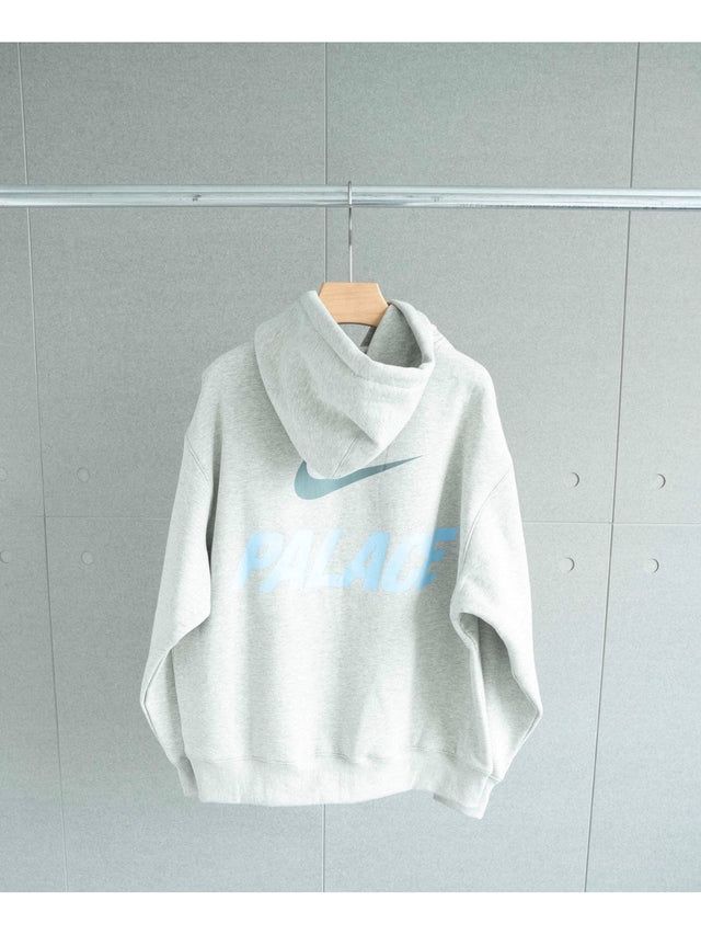 Buzo Nike blanco con swoosh celeste
