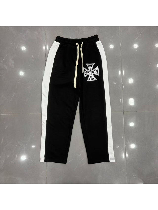 Pantal�n negro con franjas blancas y emblema � Mixed Emotion | Mixed Emotion