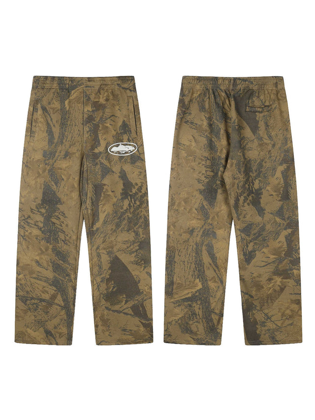 Pantal�n camuflado marr�n con emblema blanco | Corteiz