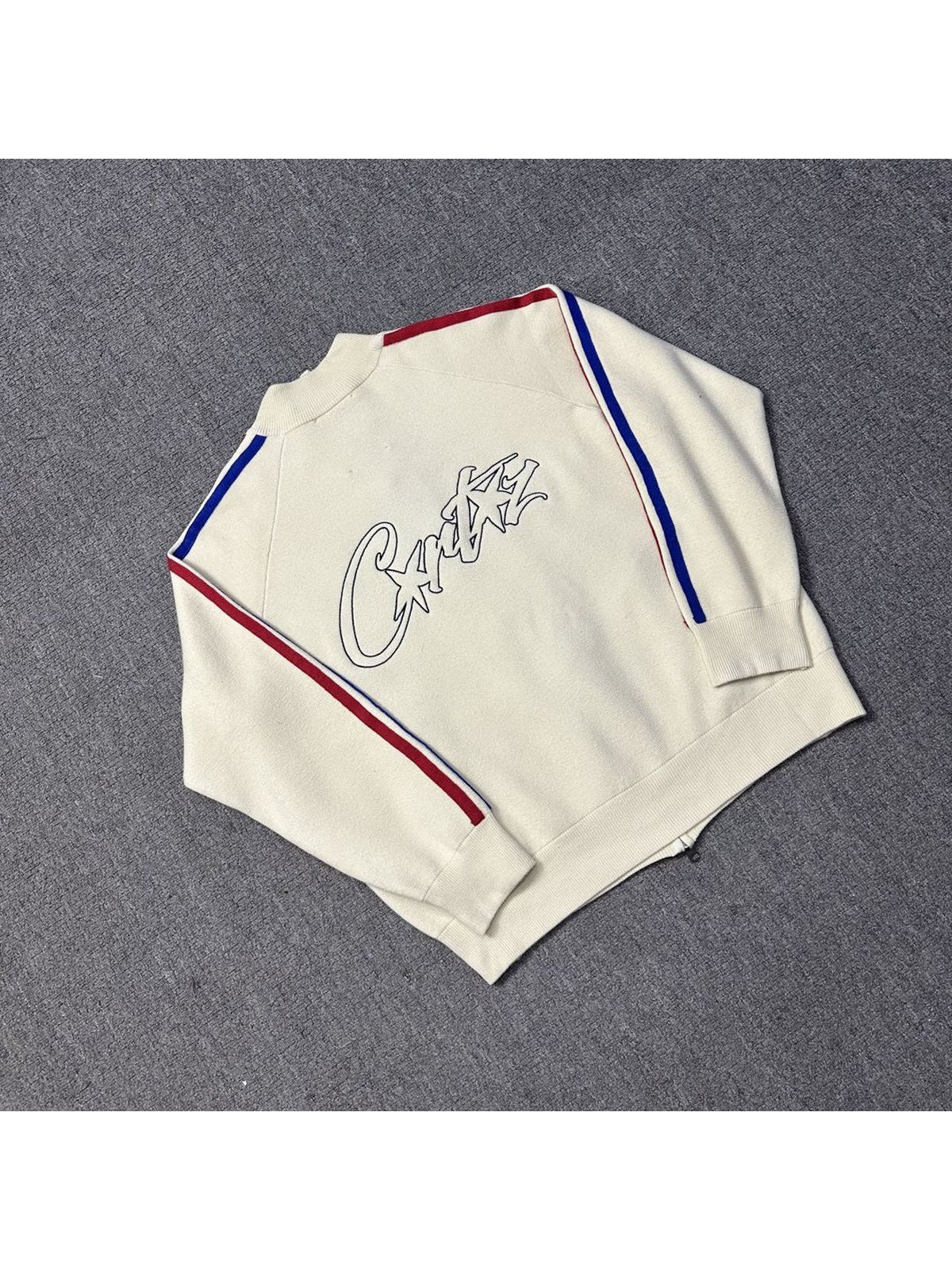 Campera crema con l�neas rojas y azules | Corteiz
